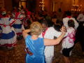 Primary view of [2003 World Dance Alliance V General Assembly of The Americas attendees dance at closing ceremony dinner]