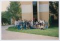 Photograph: [Photograph of TAMS students on building side]