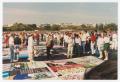 Photograph: [People around the AIDS Memorial Quilt]