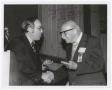 Photograph: [Paul Kruse accepting a certificate from University President C.C. "J…