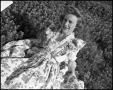 Photograph: [Avesta Favorite Edna Jo Allen Posing in a Field #1, 1944]