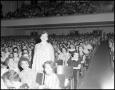 Photograph: [Shirley Boone standing in an audience]