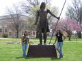 Photograph: [Women by statue at Haskell University]