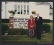 Photograph: [Photograph of a man and woman in front of a church]