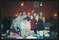 Photograph: [11 people standing behind a table: Lone Star Ride 2003 event photo]