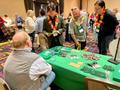 Photograph: [Guests visiting UNT's Department of Learning Technologies table]