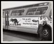 Photograph: [A Pet-Mit advertisement on the side of a bus]