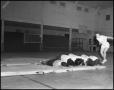 Photograph: [Women's gymnastics student tumbling, 1942]