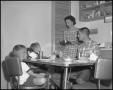 Photograph: [Family Sharing a Meal]