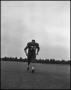 Photograph: [Football Player No. 72 Running on the Field, September 1962]