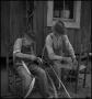 Photograph: [Father and Son Caning a Chair]