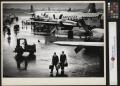 Photograph: [Pilots returning from their flight]