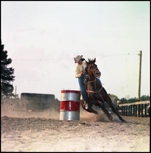 Primary view of object titled '[Woman barrel racing]'.