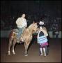 Photograph: [Man on horseback receives award]