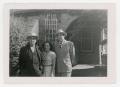Photograph: [Macario, Mary, and Frank Cuellar Sr. in front of house]
