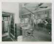 Photograph: [Carl Nelson at Desk in Nelson Hardware]