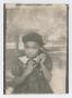 Photograph: Young girl holding telephone receiver