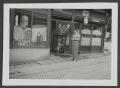 Primary view of [Marjorie Wakeham Outside a Storefront]