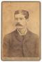 Photograph: [Portrait of a Man With Dark Handlebar Style Mustache]