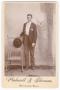 Photograph: [Unknown Young Man Holding a Hat]