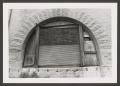 Photograph: [Arched Window Boarded Up]