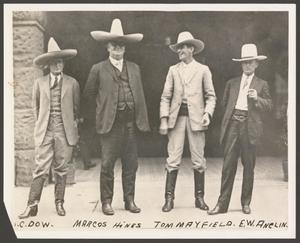 [Four Men Wearing Cowboy Hats]