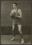 Photograph: [Male Basketball Player Holding a Basketball]