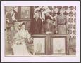 Photograph: [Asberry Family Posing with Portraits]