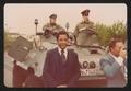 Photograph: [Lee Brown and Darryl Gates in Front of a Tank]
