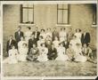 Photograph: [Group of people in front of building on Simmons College campus]