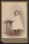 Photograph: [Portrait of an Unknown Girl Next to a Table]