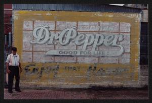 [C. B. Morgan Posing Next to his Dr. Pepper Graffiti Art]