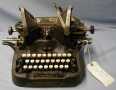 Physical Object: [Oliver typewriter that has octagonal white keys.]