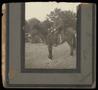 Primary view of [Dr. Leslie Eugene Kelton on the Back of a Mule]