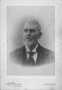 Photograph: [Portrait of an older man with a white beard and a black tie]
