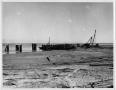 Photograph: [A view of the docks and pipelines under construction in Texas City i…