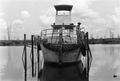 Primary view of [Worker Securing Lines on a Boat in the Neches River]