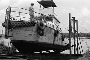 Primary view of object titled '[Boat in Dry Dock at B and B Shipyard #1]'.