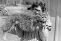 Photograph: [Barbara Lewis Holding a Maine Coon Cat]