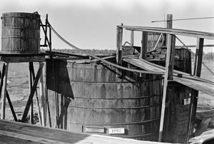 Primary view of object titled '[Top of a Wooden Oil Tank at Ada Belle Oil Field]'.