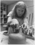 Photograph: Ceramics Student Working at a Potter's Wheel