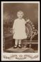Photograph: [Portrait of an Unknown Girl Standing on a Wicker Chair]