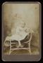 Photograph: [Portrait of an Unknown Child in a Wicker Seat]