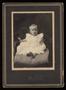 Photograph: [Portrait of an Unknown Child Sitting on a Pillow]