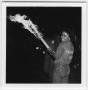 Photograph: [Talon Club member with bonfire torch, 1983]