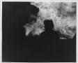 Photograph: [Man silhouetted against North Texas Homecoming bonfire, c. 1980]