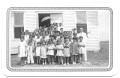 Photograph: [Class of Young Children Standing in Front of a Church]