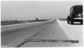 Photograph: [Photograph of a Ruler on a Road]