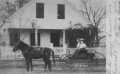 Postcard: [Della and Therese Wilson in a carriage in front of home in Brazoria,…