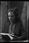 Photograph: [Gertrude Snearly Kelley reading a book]